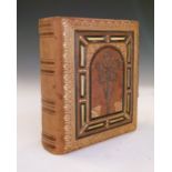 Late Victorian album of photographic portrait cards in gilt surrounds, with decorated front board,