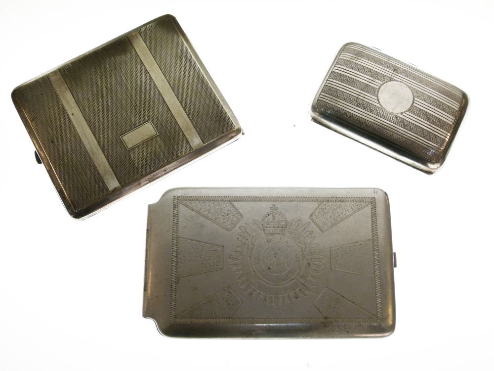 George V silver cigarette case, Birmingham 1921, 2.3toz approx, together with two base metal