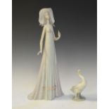 Lladro figure of an elegant lady in broad rimmed hat, 34.5cm tall, together with a Lladro goose