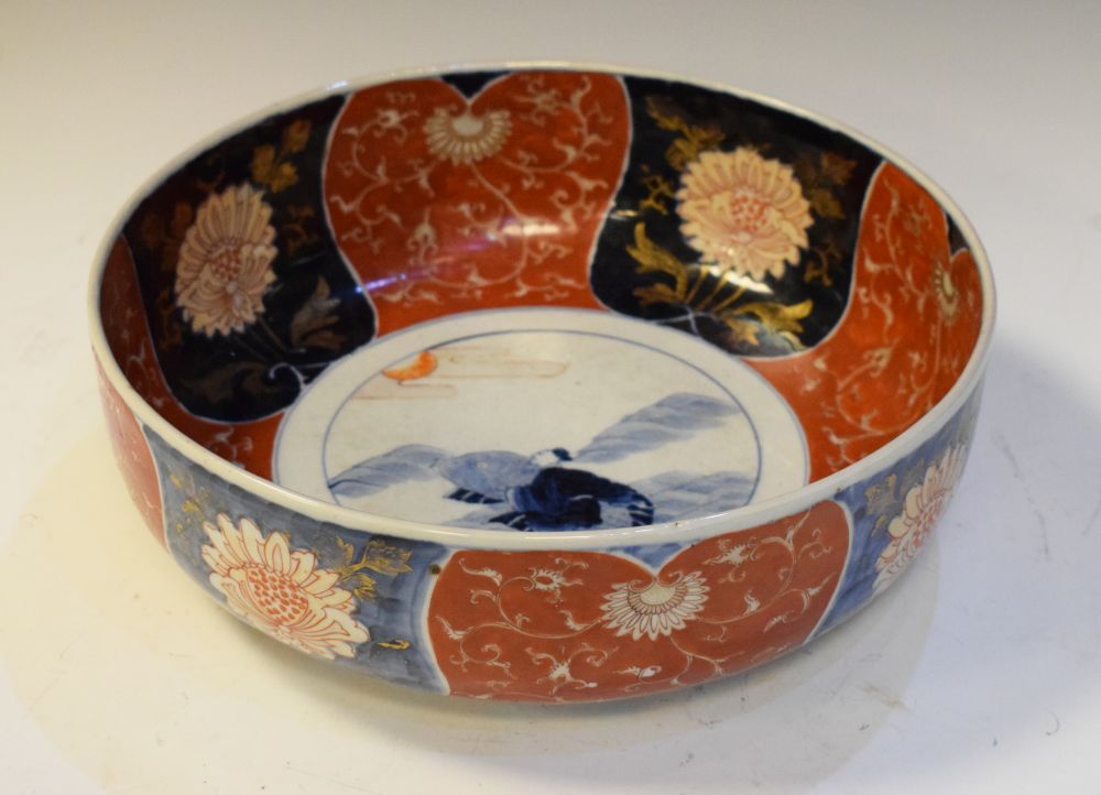 Imari bowl decorated with figure and a carp, the border with alternate iron red and underglaze