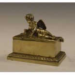 Cast brass box, the hinged cover with decoration of Cupid, 10cm wide