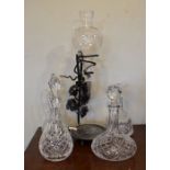 Four cut glass decanters, and a wrought metal and glass wine pourer