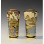 Pair of Satsuma baluster shaped vases decorated with geisha, temples and wisteria, the bases
