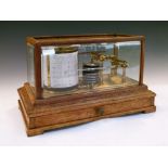 Early to mid 20th Century light oak barograph, with seven-tier vacuum and lacquered brass