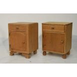 Stripped pine bedside cabinet of single drawer over cupboard, together with another similar (2)