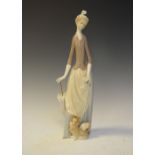 Lladro figure of lady with lapdog, 35cm high