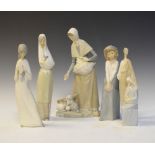 Lladro figure group, together with three Nao figure groups and a bisque glazed figure of a girl with