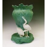 Bretby pottery jardinière, the leaf moulded central section surrounded by three white cranes,