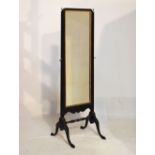 Ebonised cheval mirror, 142cm high