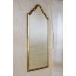 Reproduction arched bevelled gilt framed wall mirror, 88cm high