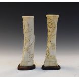 Pair of early 20th Century carved bone spill vases, each modelled with sunflowers, 21cm high