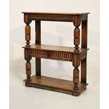 Good quality old reproduction oak three-tier buffet having central drawer, raised on turned