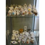 Group of assorted crested china wares to include fireplace, Coronation chair, camel, tank,