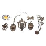 Assorted silver and white metal jewellery to include; three early 20th Century fobs, three brooches,