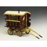 Wooden decorative Romany Vardo caravan, scarlet and yellow, measures approximately 35cm x 46cm x