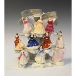 Group of ten Royal Doulton miniature 'Pretty Ladies' with original display stand, together with nine