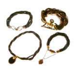 Four assorted late Victorian/Edwardian woven bracelets with yellow metal clasps and fasteners, one