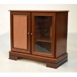 Mahogany finish side cabinet fitted one glazed and one panel door, 81cm wide