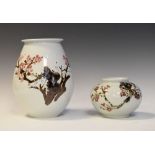 Two Oriental porcelain vases, each with prunus blossom decoration, the larger 23cm high (2)