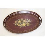 Oval metal tray having pierced gallery with hand painted floral decoration, 60cm wide