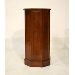 Reproduction yew finish octagonal drinks cabinet with hinged door enclosing a glass shelf, 41cm wide