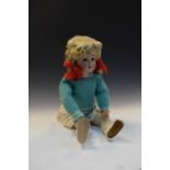 Early 20th Century German made bisque headed doll of girl wearing green dress, marked 1,031 to