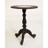 Anglo-Indian heavily carved hardwood circular tripod table, 44cm wide