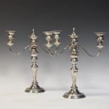 Pair of silver plated three-branch candelabra, 33.5cm high