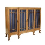 Early 20th Century light oak feather-banded breakfront bookcase, fitted four doors, 152cm wide