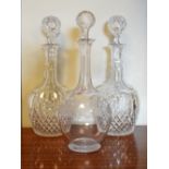 Pair of cut glass decanters and one other etched glass similar