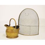 Brass wire work spark guard and a brass helmet shaped coal bucket