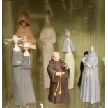 Assorted Spanish and other porcelain figurines depicting monks and nuns, largest 34cm high (7)