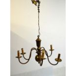 Brass Dutch style five branch chandelier and one other similar six branch chandelier