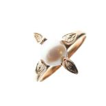 Yellow metal dress ring set central pearl, shank stamped 14K, 2.7g gross approx