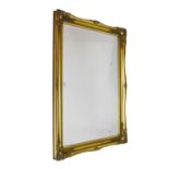 Reproduction rectangular bevelled glass wall mirror having gilt frame, 75cm x 106cm overall