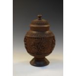 Eastern (possibly Indian) carved wooden canister, the domed push-on cover enclosing metal