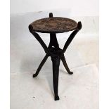 Carved African folding stool with reversible top having carved figures of elephants and rhino, the
