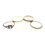 22ct gold wedding band, another 22ct gold and platinum wedding band, and a 9ct gold wedding band,