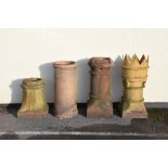 Four terracotta chimney pots, the tallest crown example standing 72cm high