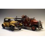 Two tin plate reproduction vintage style American Fire Trucks (34cm), together with a yellow Motor