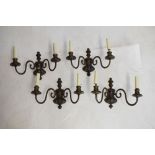 Four two branch patinated scroll arm wall light fittings