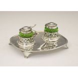 Edward VII Art Nouveau silver and green glass desk stand, the rounded oblong tray with whiplash