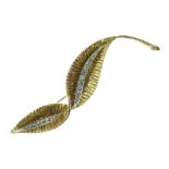 18ct gold and diamond stylised leaf brooch, by David Shackman & Son, London 1967, set with a central