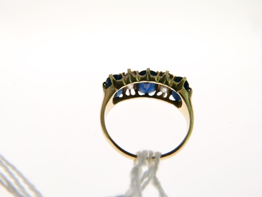 Sapphire and diamond ring, the three graduated oval cuts with pairs of old cut diamonds between, - Image 4 of 6