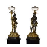 Two monumental late 19th Century cast bronze and ormolu figural lamps, each modelled as a warrior