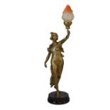 Early 20th Century French gilt spelter figural lamp, modelled as a maiden holding a torch aloft,