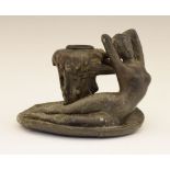 French Art Nouveau lead figural chamber candlestick, the handle cast as a reclining naked female,