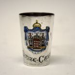 Continental white metal tot beaker of tapering cylindrical form with enamel arms of 'Monte Carlo',