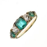 Five stone emerald and diamond ring, the graduated emeralds with an old mine cut between, and rose