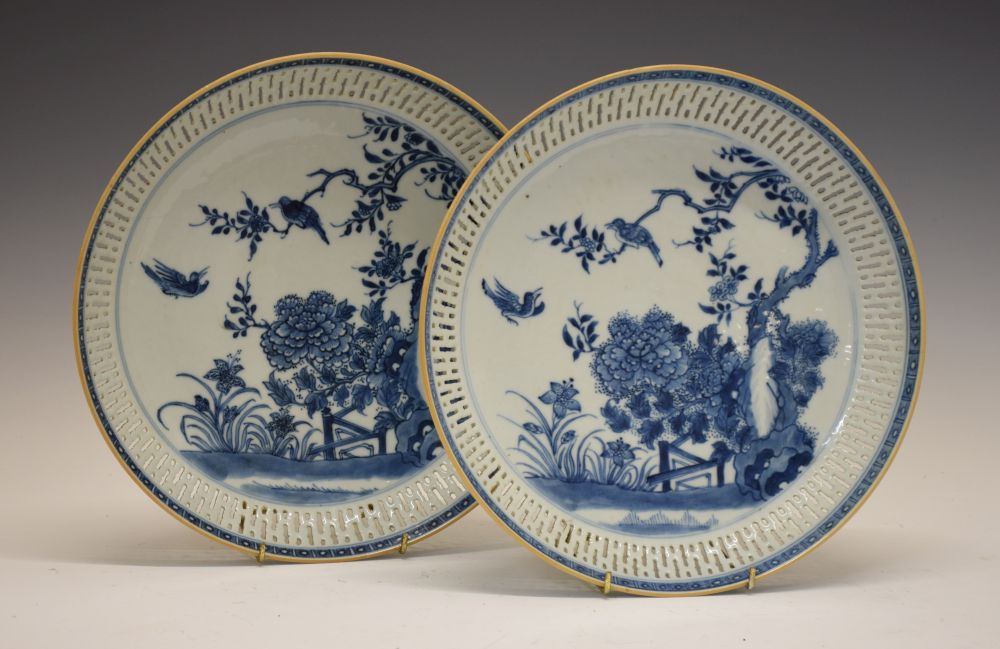 Pair of Chinese blue and white porcelain dishes, each of circular form with reticulated borders,